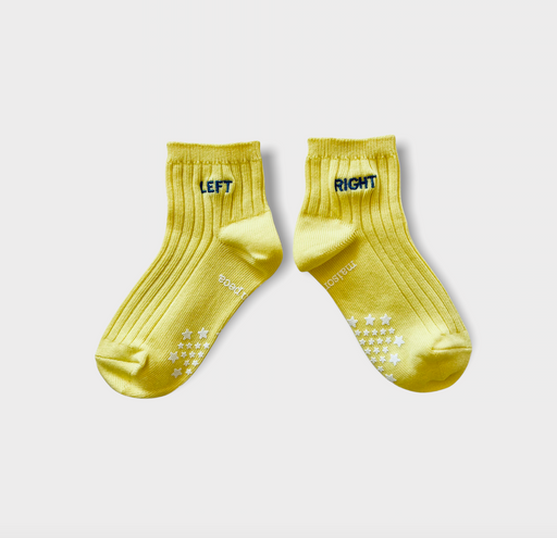 A pair of yellow kids socks with blue "LEFT" and "RIGHT" embroidered on ankle