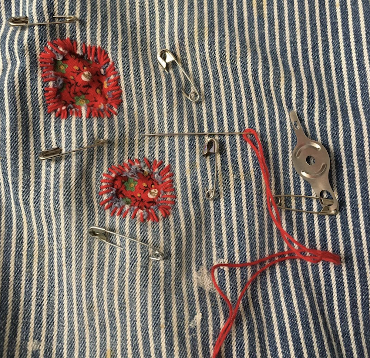 Hand sewn thread detail on fabric
