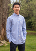 Male model wearing blue & white striped button down long sleeve shirt with collar
