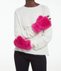 Model wearing hot pink furry fingerless gloves