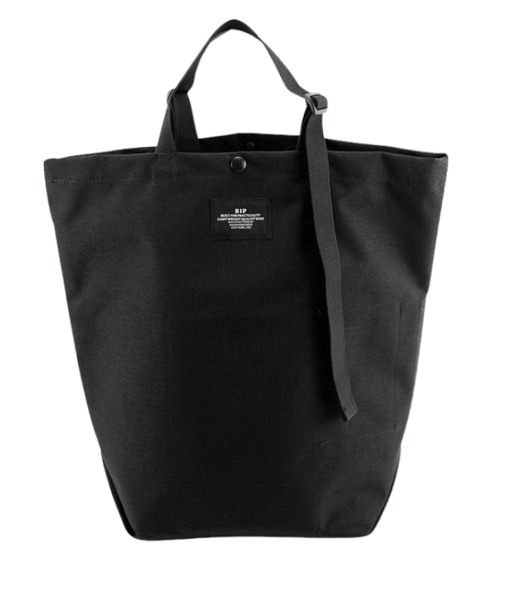 Black canvas tote with snap closure and adjustable straps