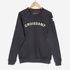Gray long sleeve sweatshirt with appliqué reading "CROISSANT" on front