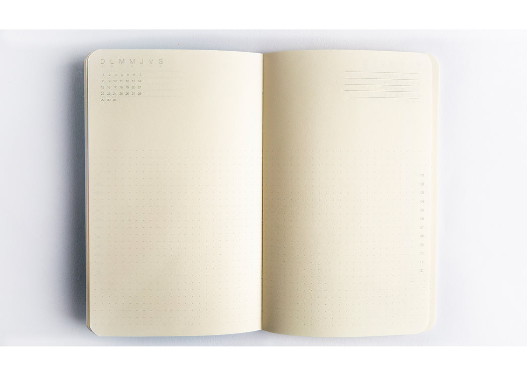 2-page interior spread of the Timeless Agenda  notebook showing lightly dotted background & calendar