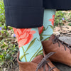 Model wearing Aqua colored sock with pink peony design and brown shoes