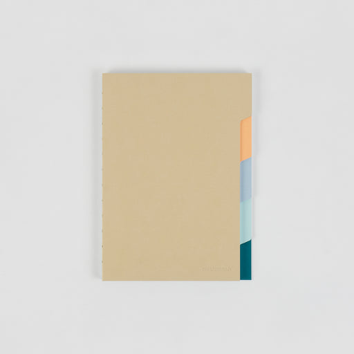 Sand color notebook with yellow, blue and green tabs