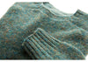 Dark green colored long sleeve wool sweater: close-up on crewneck and wrist cuff