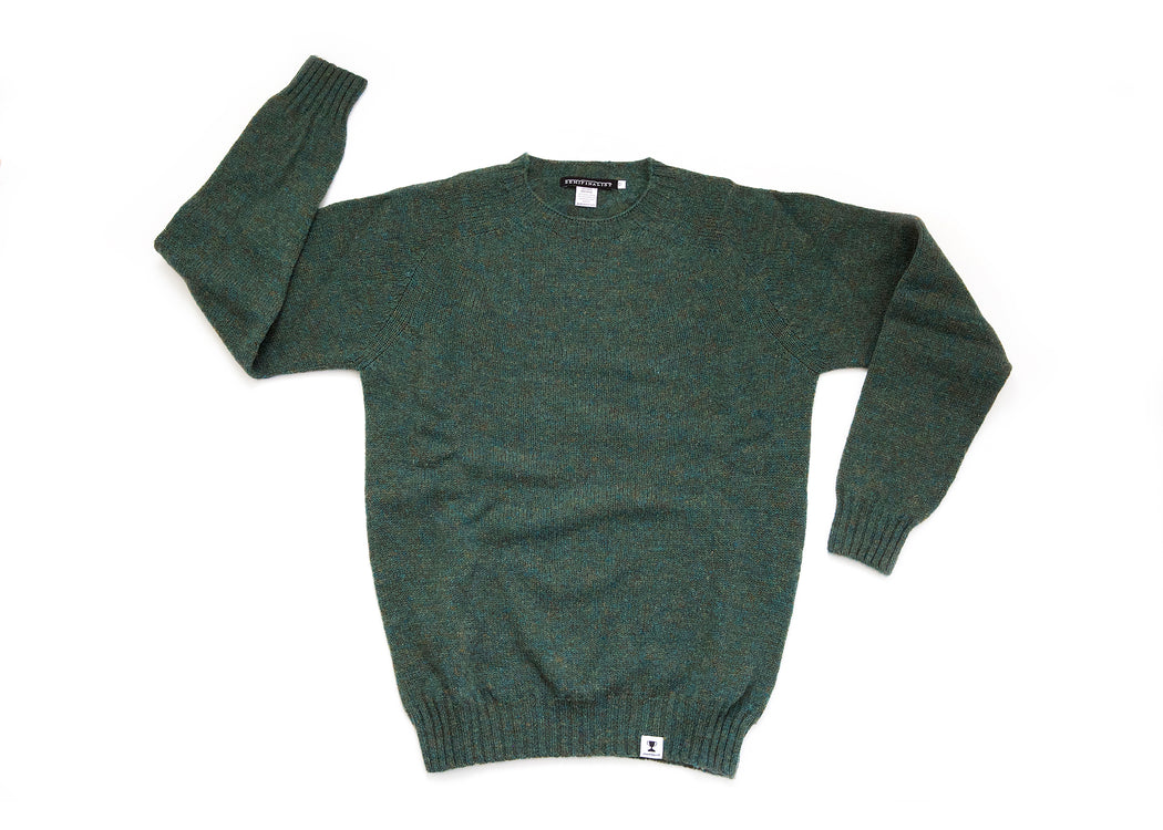 Dark green colored long sleeve wool crewneck sweater