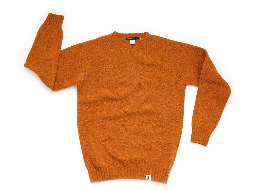 Rust colored long sleeve wool crewneck sweater