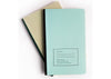 Two agenda notebooks- one light blue & one tan
